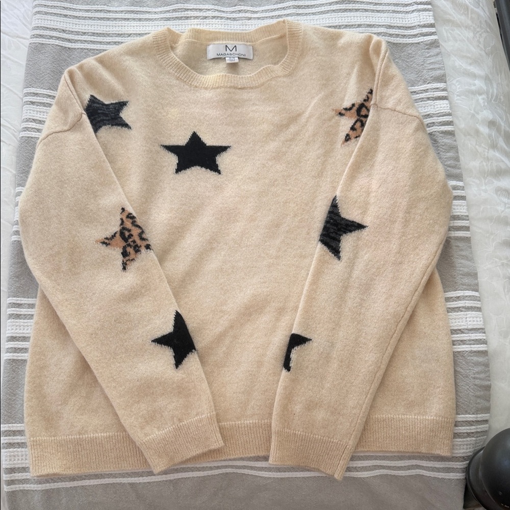 Magaschoni Cream Sweater with Black and Brown Star Accents